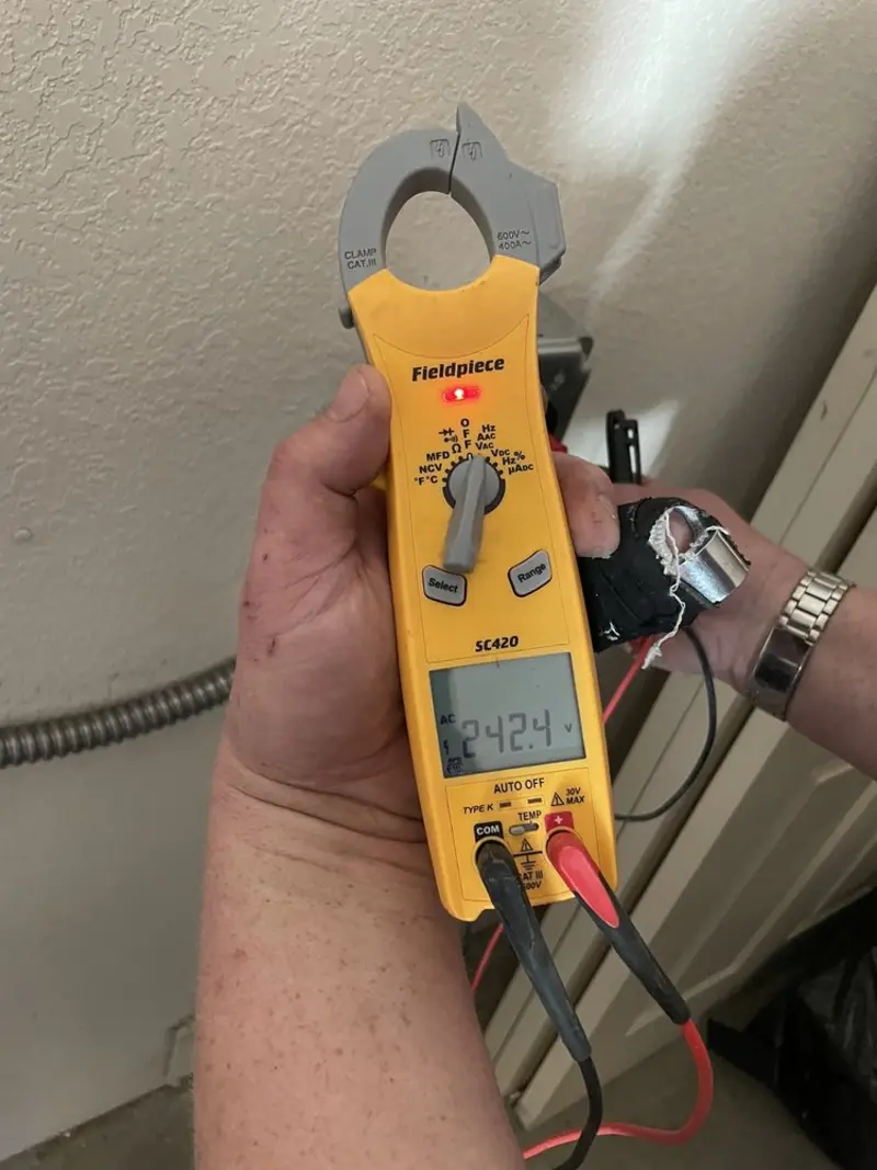 Voltage testing with clamp meter during Electrical Installation Services in Waterville